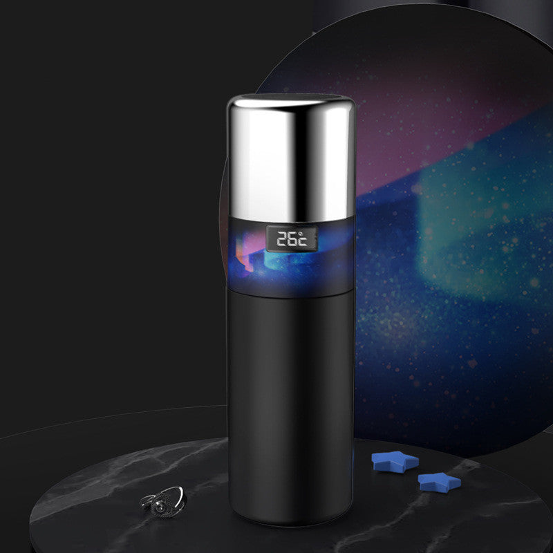 Black vacuum temperature bottle with digital 26°C display and blue glow