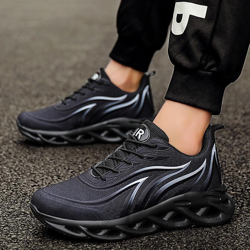 Black lace-up running shoes with curved stripe detail and cushioned sole