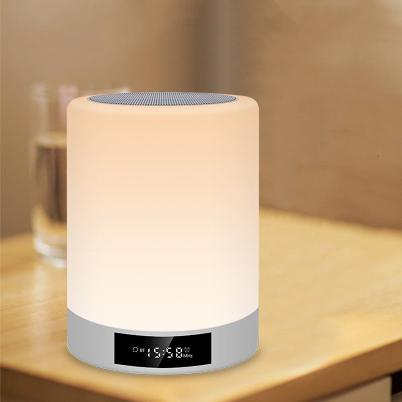 Warm white rechargeable night light speaker on desk with digital time display