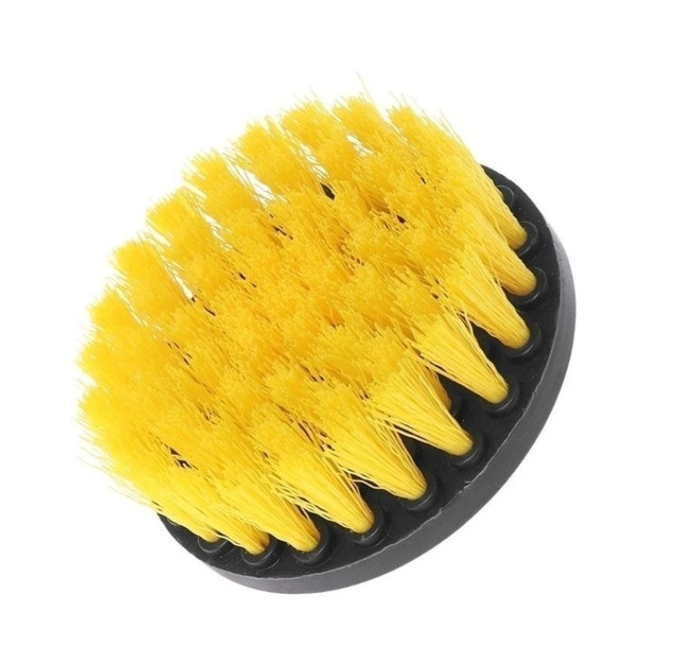 Close-up yellow bristle drill brush head with black base and metal shaft