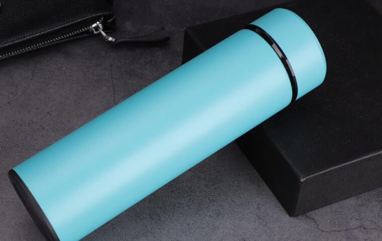 Light blue insulated vacuum bottle with LED temperature display on dark end cap