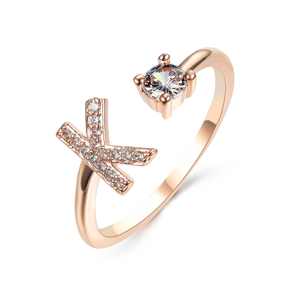 Rose gold initial letter ring with pavé rhinestones and round center crystal