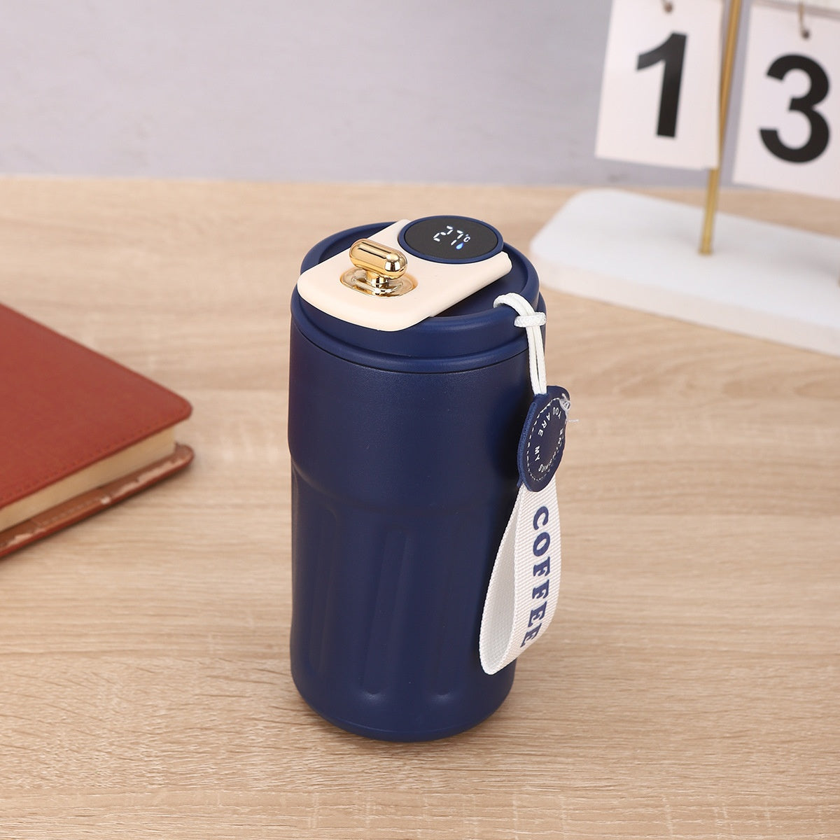 450ml insulated thermal bottle with navy blue body, cream top, digital temperature display