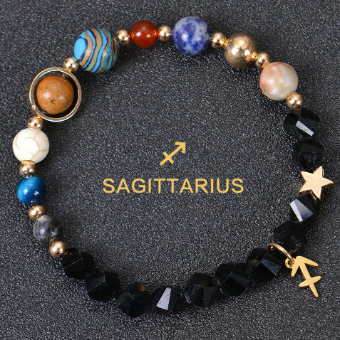 Zodiac beaded bracelet with black faceted beads, gold spacers, Sagittarius charm and star