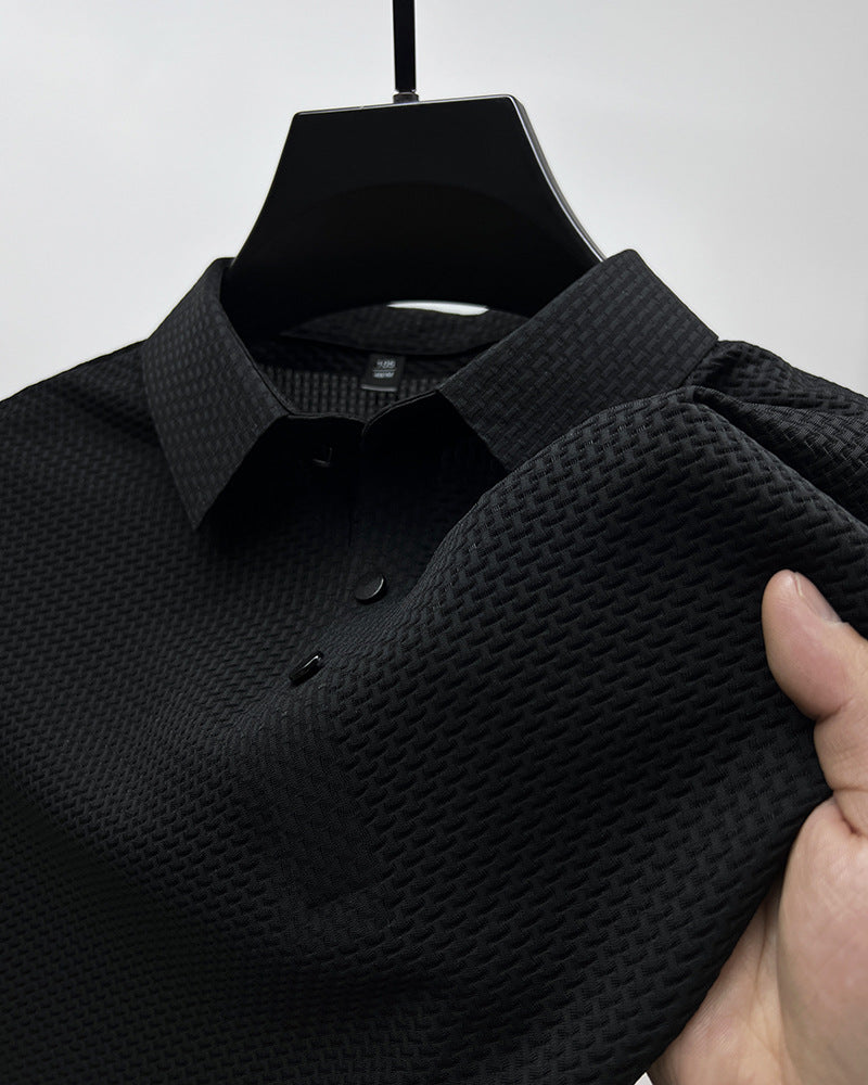 Men's textured mesh polo shirt in black, short sleeves and button placket