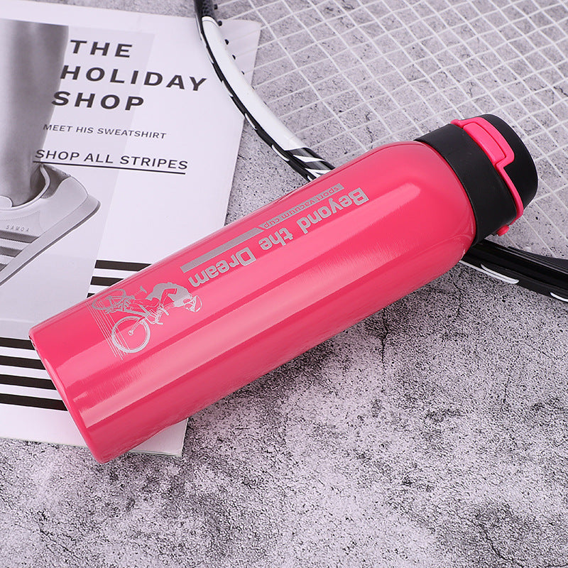 Bike water bottle in pink with black flip cap and red trim