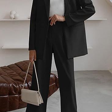 Women’s black coat and trousers suit, long blazer jacket with wide-leg trousers